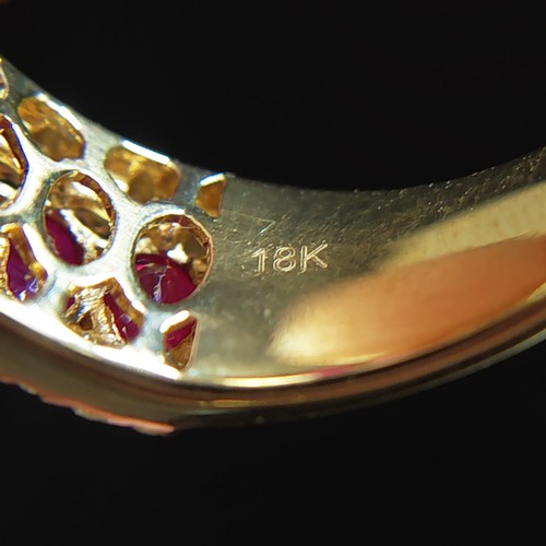 23 - 18ct yellow gold ring set with 11 oval rubies with RBC diamonds set above and below. Rubies 2.69ct. ... 