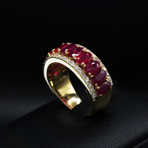 23 - 18ct yellow gold ring set with 11 oval rubies with RBC diamonds set above and below. Rubies 2.69ct. ... 