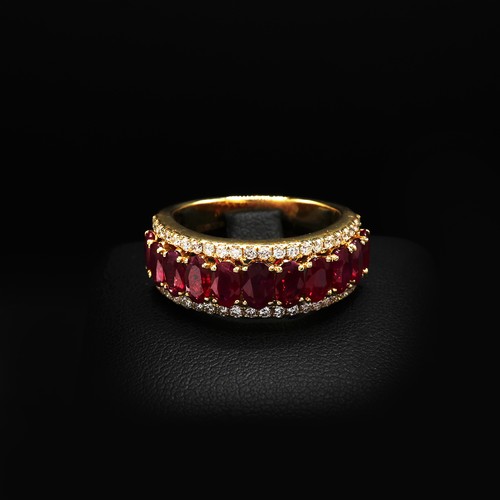 23 - 18ct yellow gold ring set with 11 oval rubies with RBC diamonds set above and below. Rubies 2.69ct. ... 