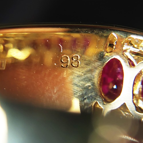 23 - 18ct yellow gold ring set with 11 oval rubies with RBC diamonds set above and below. Rubies 2.69ct. ... 