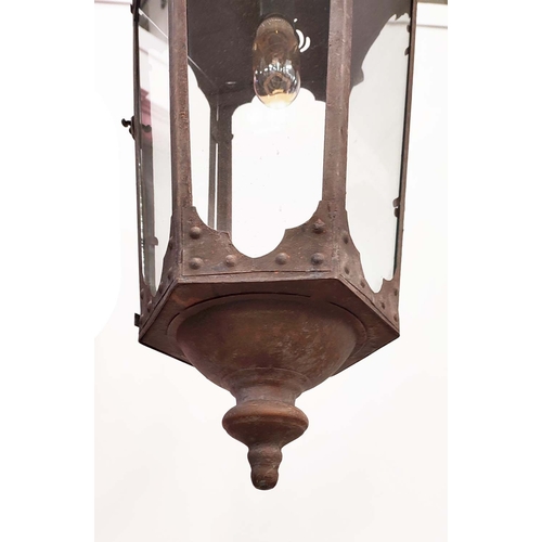 515 - A PAIR OF HANGING WALL LANTERN LIGHTS, antiqued oxidised frames, hexagonal frames, 75cm H. (2)