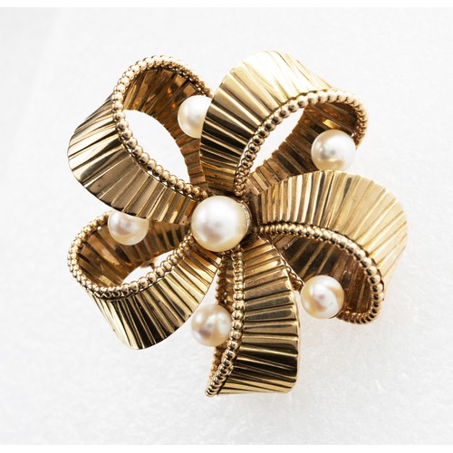 77 - A YELLOW METAL AND PEARL BROOCH, probably 9ct gold, in the form of a ribbon bow, ridge body, probabl... 