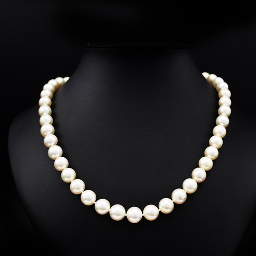 82 - A SINGLE STRAND CULTURED PEARL NECKLACE, having 45 individually knotted 10mm round pearls, fitted wi... 