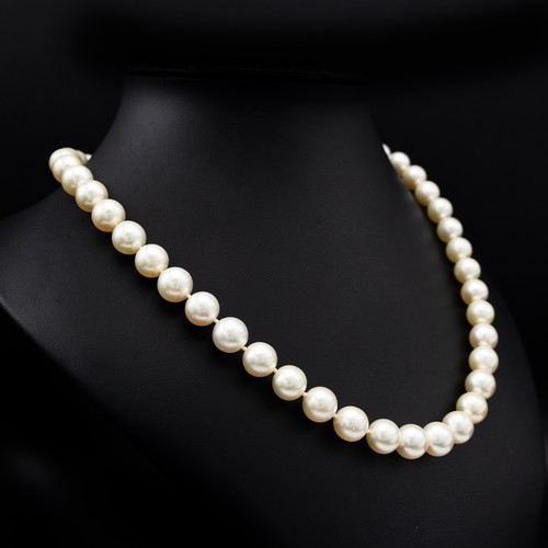 82 - A SINGLE STRAND CULTURED PEARL NECKLACE, having 45 individually knotted 10mm round pearls, fitted wi... 