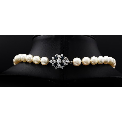 82 - A SINGLE STRAND CULTURED PEARL NECKLACE, having 45 individually knotted 10mm round pearls, fitted wi... 