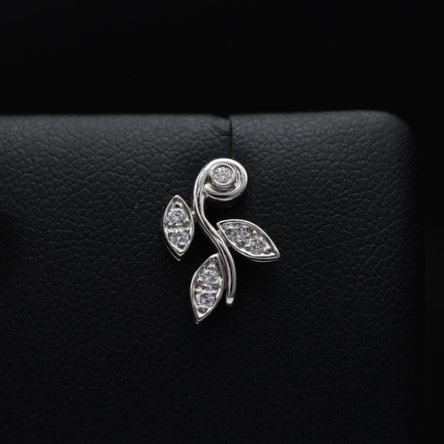 115 - A PAIR OF TIFFANY PLATINUM DIAMOND SET EARRINGS, each in the form of foliage and set with seven roun... 