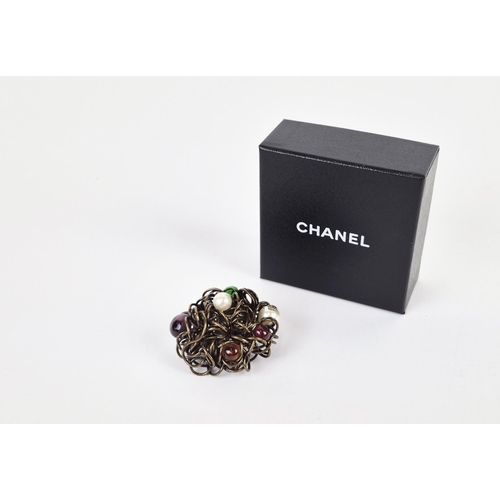 13 - CHANEL BROOCH, bronze tone metal with encrusted faux pearls and stones, with safety pin closure, wit... 