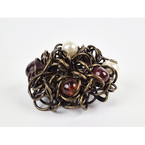 13 - CHANEL BROOCH, bronze tone metal with encrusted faux pearls and stones, with safety pin closure, wit... 