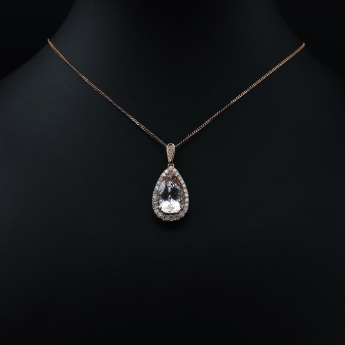 130 - AN 18CT ROSE GOLD MORGANITE AND DIAMOND PENDANT NECKLACE, the pear shaped central stone of approxima... 