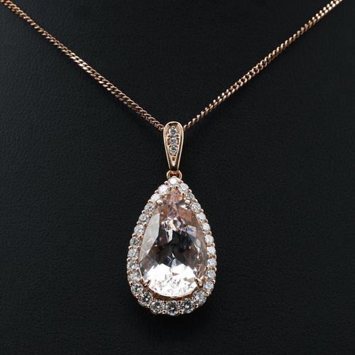 130 - AN 18CT ROSE GOLD MORGANITE AND DIAMOND PENDANT NECKLACE, the pear shaped central stone of approxima... 