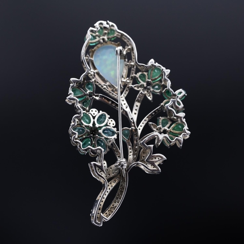 134 - Foliate bar pin brooch set with a cabochon pear shaped opal, pear-shaped emeralds and diamonds, in s... 