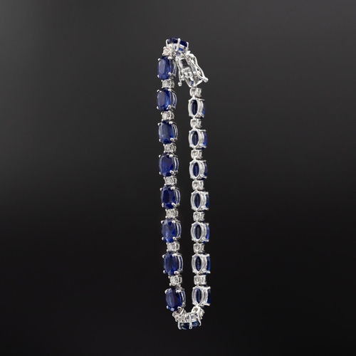 135 - Certificated 18ct white gold oval kyanite and diamond line bracelet, boxed. Kyanites 19.25ct. Diamon... 