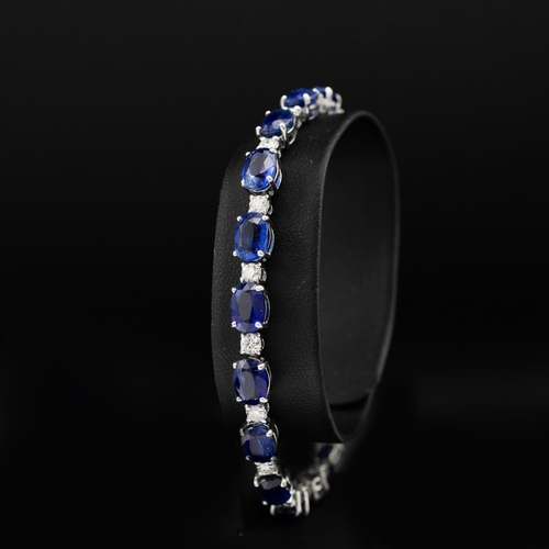 135 - Certificated 18ct white gold oval kyanite and diamond line bracelet, boxed. Kyanites 19.25ct. Diamon... 