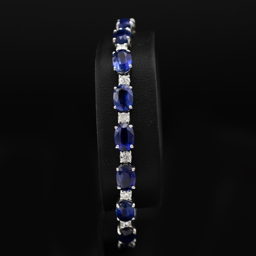 135 - Certificated 18ct white gold oval kyanite and diamond line bracelet, boxed. Kyanites 19.25ct. Diamon... 