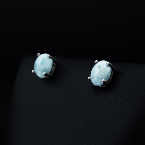 136 - Collection of 4 pairs of silver studs set with natural oval cabochon gemstones: larimar, Ethiopian b... 