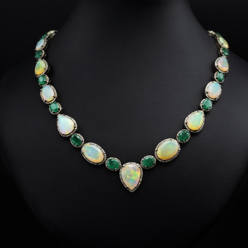 139 - Silver necklace set with faceted oval and pear-shaped opals, oval emeralds and rose-cut diamonds, in... 