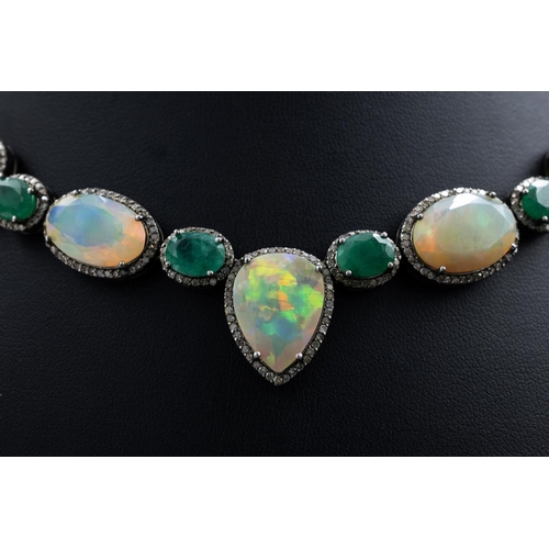 139 - Silver necklace set with faceted oval and pear-shaped opals, oval emeralds and rose-cut diamonds, in... 