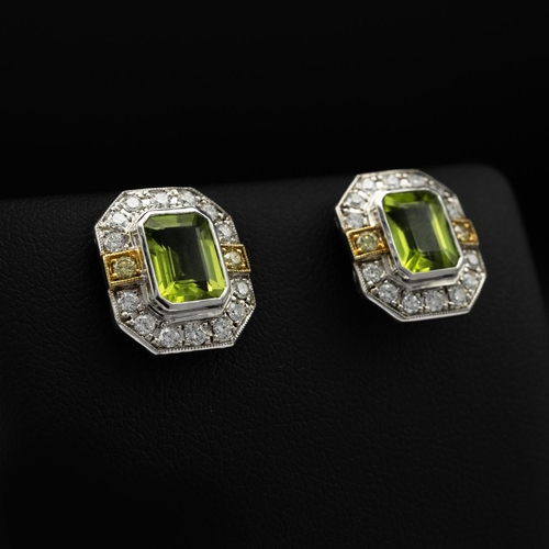 141 - Certificated pair of 18ct white and yellow gold earrings set with octagonal cut peridots and RBC dia... 