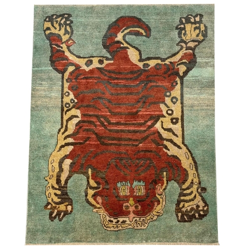 257 - FINE TIBETAN TIGER RUG, 226cm x 175cm.