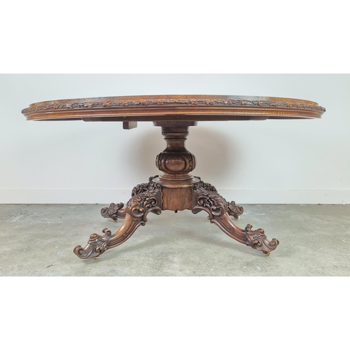 299 - LOO TABLE, Victorian walnut, circa 1850, quarter veneered burr top with leaf carved frieze raised on... 