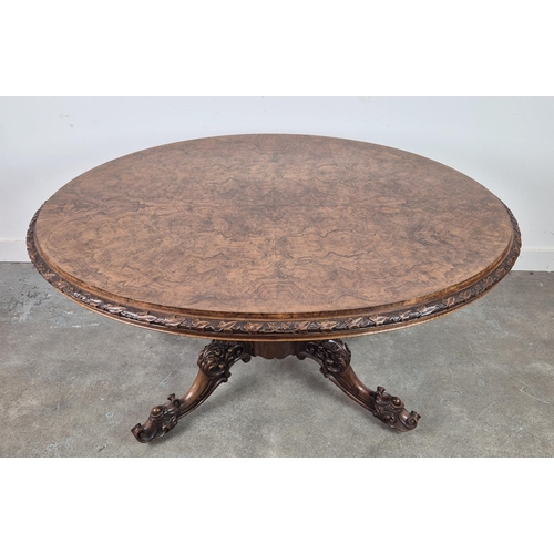 299 - LOO TABLE, Victorian walnut, circa 1850, quarter veneered burr top with leaf carved frieze raised on... 