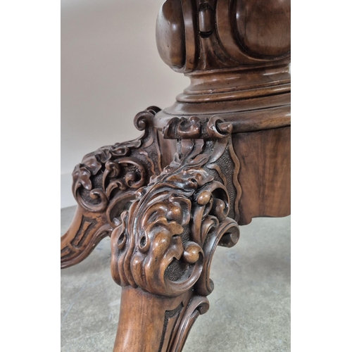 299 - LOO TABLE, Victorian walnut, circa 1850, quarter veneered burr top with leaf carved frieze raised on... 