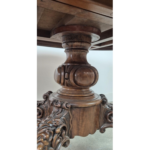 299 - LOO TABLE, Victorian walnut, circa 1850, quarter veneered burr top with leaf carved frieze raised on... 