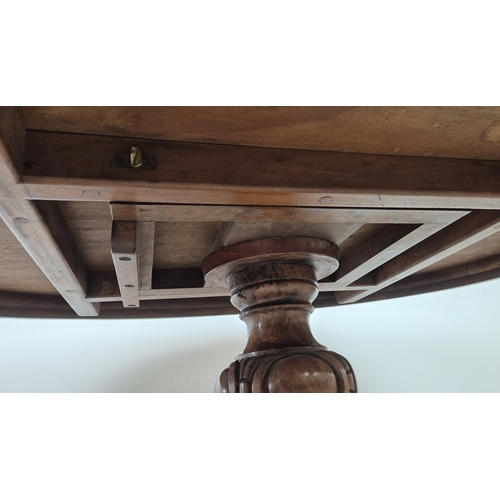 299 - LOO TABLE, Victorian walnut, circa 1850, quarter veneered burr top with leaf carved frieze raised on... 