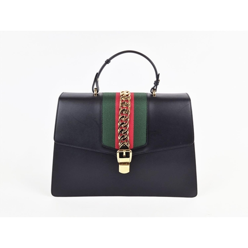 3 - GUCCI SYLVIE BAG, black leather with iconic web stripes and gold tone chain detailing on front flap,... 