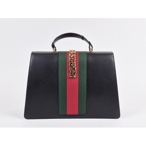 3 - GUCCI SYLVIE BAG, black leather with iconic web stripes and gold tone chain detailing on front flap,... 