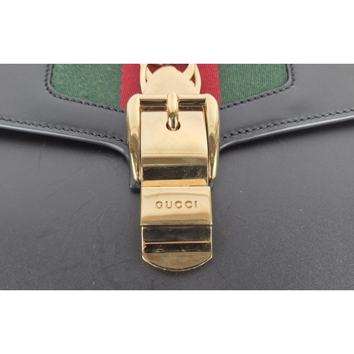 3 - GUCCI SYLVIE BAG, black leather with iconic web stripes and gold tone chain detailing on front flap,... 