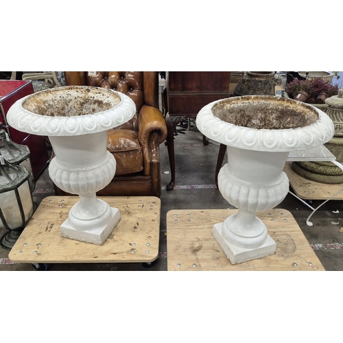 302 - GARDEN URNS, a pair, white painted iron, each 57cm W x 82cm H.