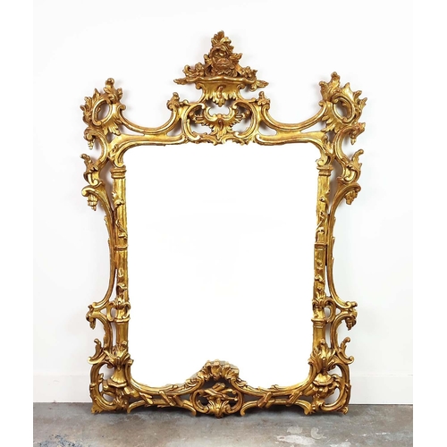 348 - WALL MIRROR, 18th century style, pierced gilt frame with C scroll crest, 140cm H x 100cm W.