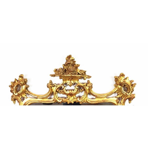 348 - WALL MIRROR, 18th century style, pierced gilt frame with C scroll crest, 140cm H x 100cm W.