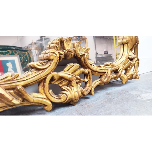 348 - WALL MIRROR, 18th century style, pierced gilt frame with C scroll crest, 140cm H x 100cm W.