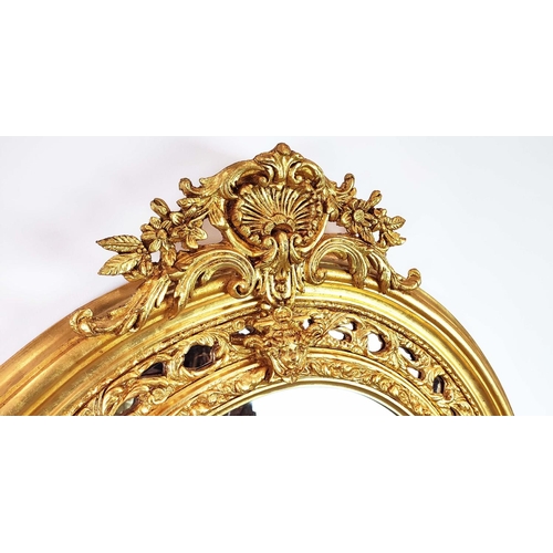 352 - OVERMANTEL, bevelled plate within ornate gilt arched frame, 195cm H x 108cm W.