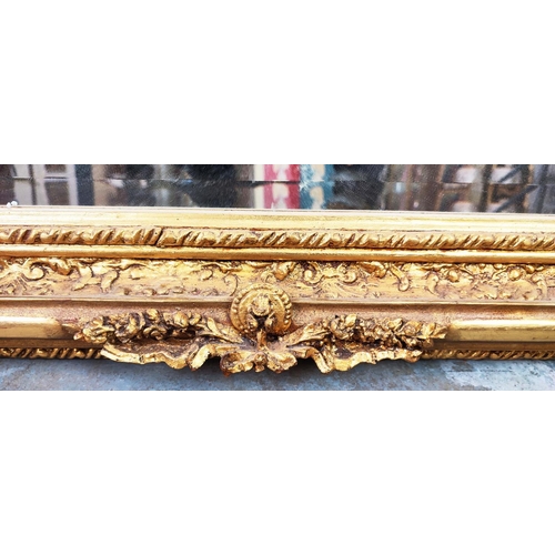 353 - OVERMANTEL, bevelled plate within ornate gilt frame with cherubs, 140cm H x 116cm W.