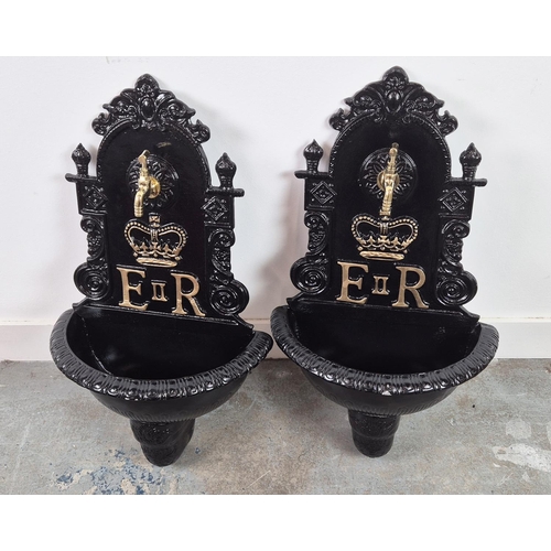 382 - WALL FOUNTAINS, a pair, black painted cast metal, 68cm H x 42cm W. (2)