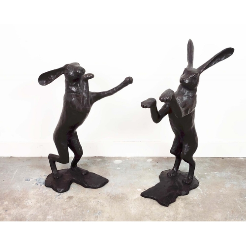 385 - BOXING HARE SCULPTURES, a set of two, cast metal, 86cm H x 33cm W x 53cm D. (2)