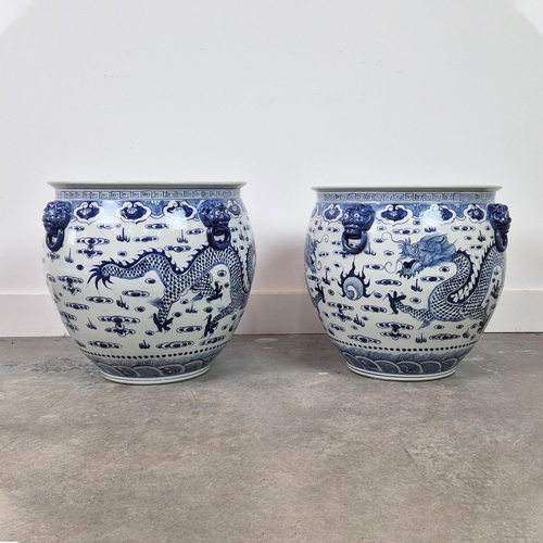 387 - PLANTERS, a pair, blue and white glazed ceramic, 42cm H x 46cm W. (2)