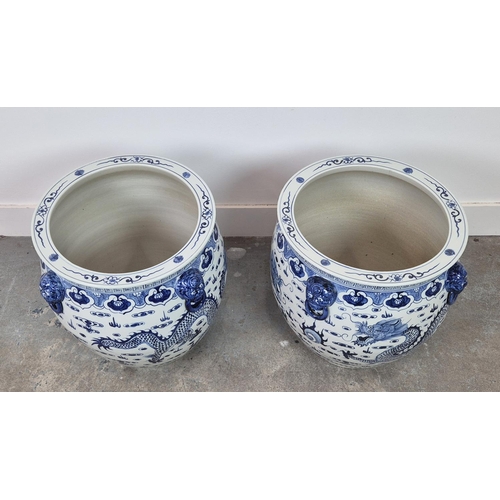 387 - PLANTERS, a pair, blue and white glazed ceramic, 42cm H x 46cm W. (2)