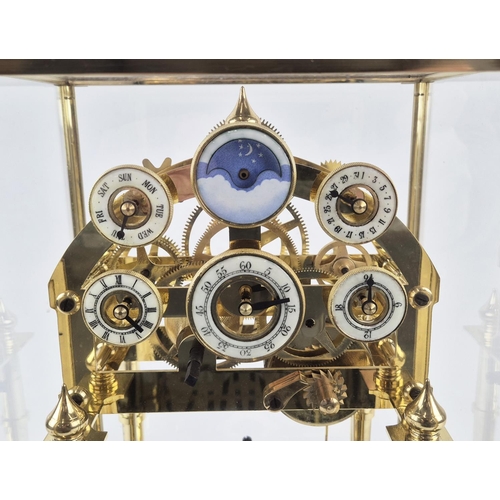 393 - CONGREVE MOON PHASE CLOCK, gilt metal and glass, 44cm H x 30cm W x 27cm D.