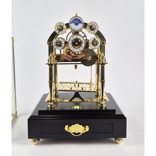 393 - CONGREVE MOON PHASE CLOCK, gilt metal and glass, 44cm H x 30cm W x 27cm D.