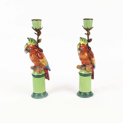 401 - CANDLESTICKS, a pair, in the form of red parrots, 29cm H approx. (2)