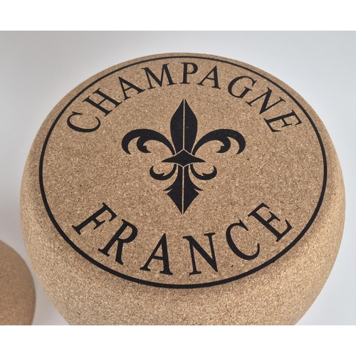 402 - STOOLS, a pair, in the form of champagne corks, 50.5cm H approx. (2)