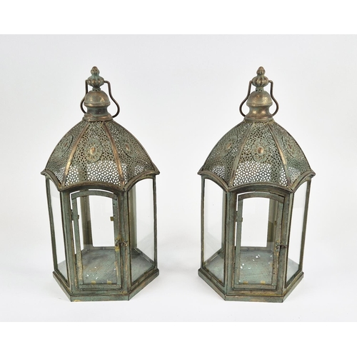 433 - STORM LANTERNS, a pair, faux Verdigris metal and glazed, 57cm H at tallest approx. (2)