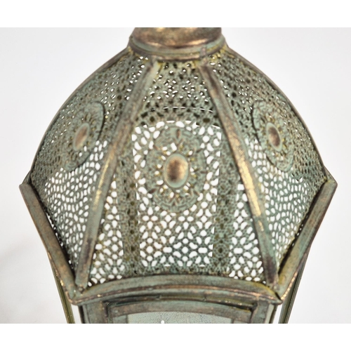 433 - STORM LANTERNS, a pair, faux Verdigris metal and glazed, 57cm H at tallest approx. (2)