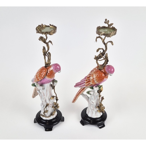 437 - CANDLESTICKS, a par, in the form of parrots, ceramic and gilt metal, 55cm H approx. (2)