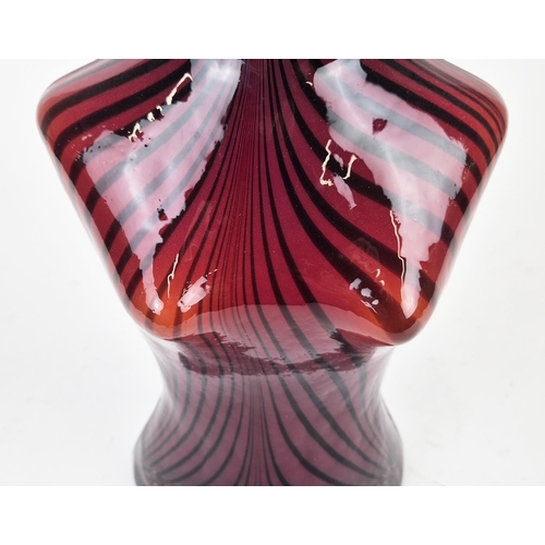 52 - A MURANO STYLE TORSO HAND BLOWN VASE, in the female form, red and black striped decoration, white op... 