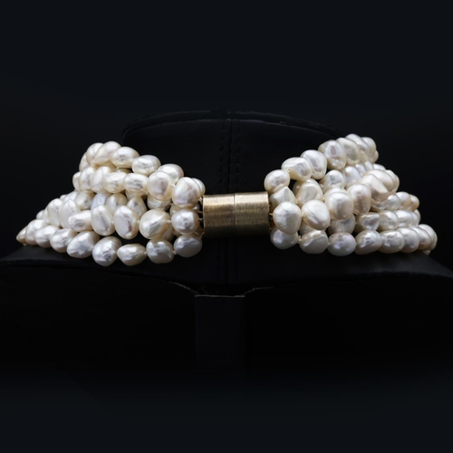 60 - A SIX SRAND FRESHWATER PEARL CHOKER NECKLACE, fitted with approximately 250 white baroque pearls, 44... 